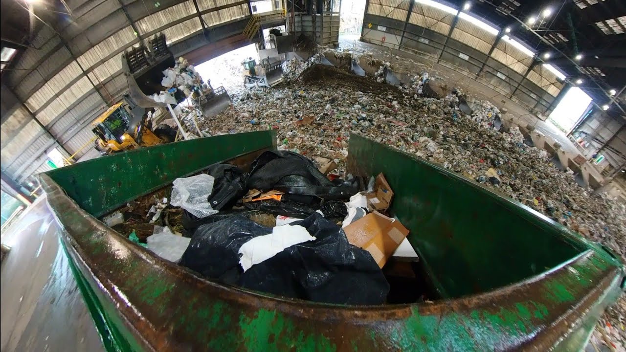 Waste Management garbage trucks dumping at transfer station Compilation 
