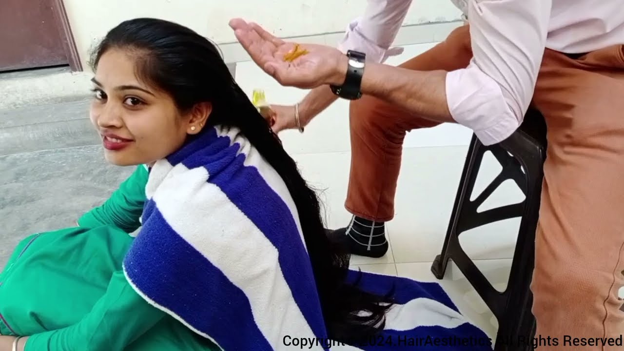 Mannu Applying excess oil on the hair and getting the hair styled and pulled