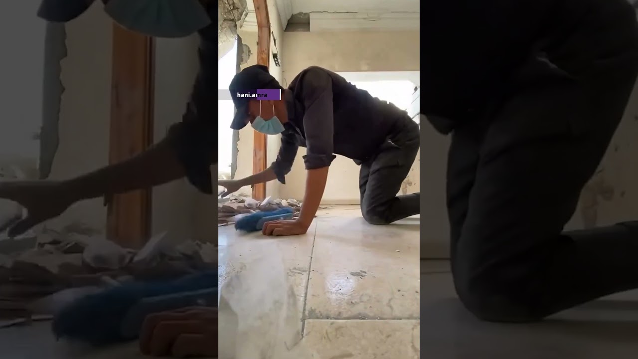 Palestinian man rebuilding his destroyed house in Gaza
