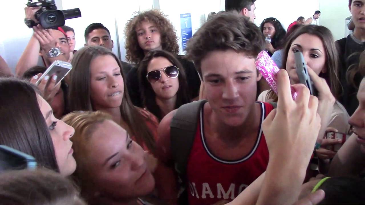Cameron Dallas and Aaron Carpenter arrive at LAX Airport and hundreds of fans are there to meet them