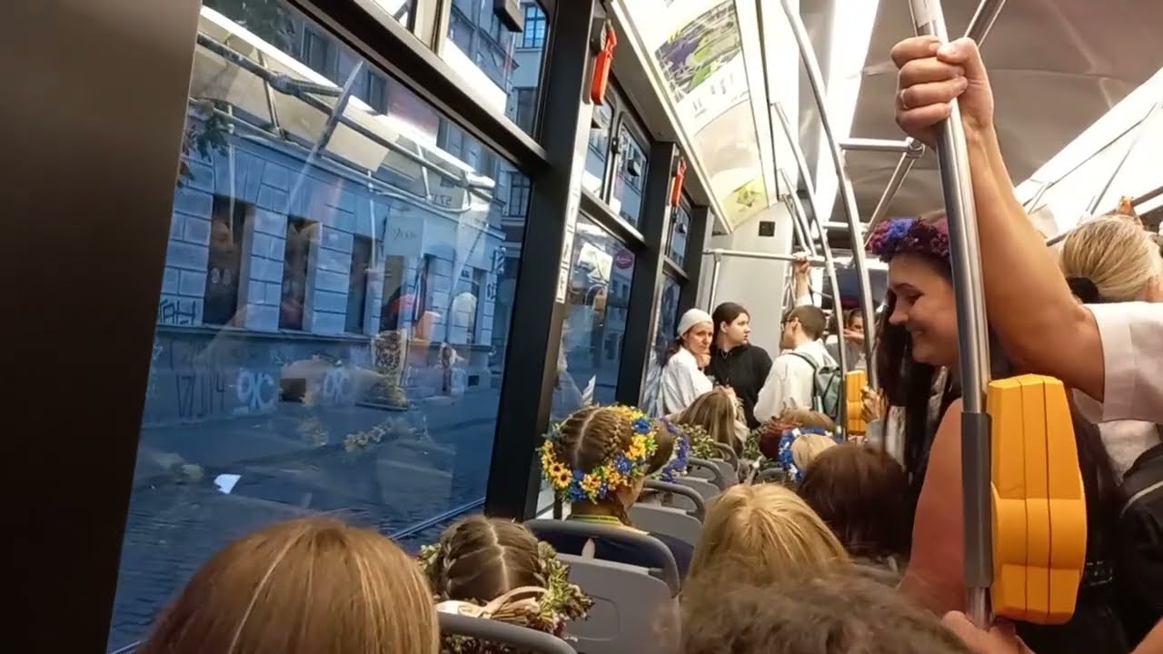 Kā mēs braucām dziedādami ar 11. tramvaju no dziesmusvētku koncerta, singing in the train.