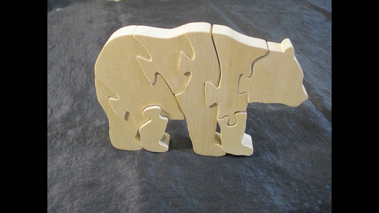 Cutting a puzzle of a bear