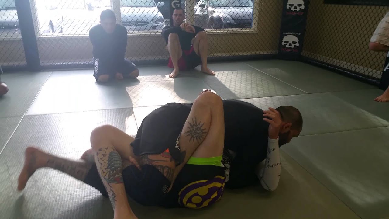 Half guard pass beating the hook
