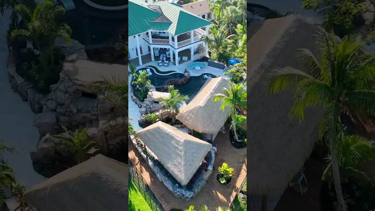 This backyard has a massive grotto, an elevated hot tub, an upper and lower pool #backyardpool #pool