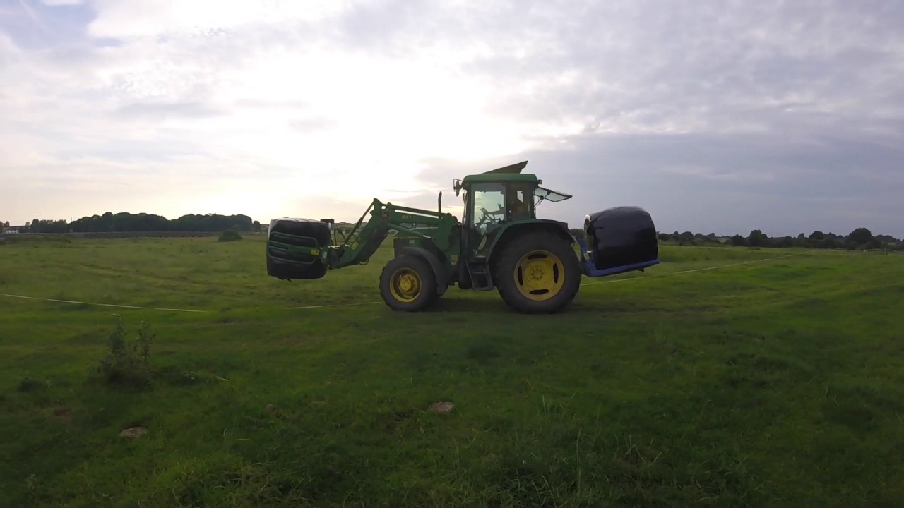 Stacking silage bales