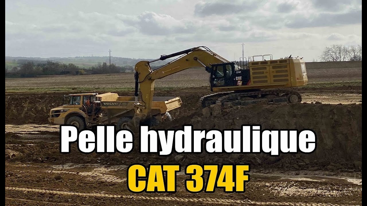 Cat 374F Large Excavator loading dumper Volvo a35g