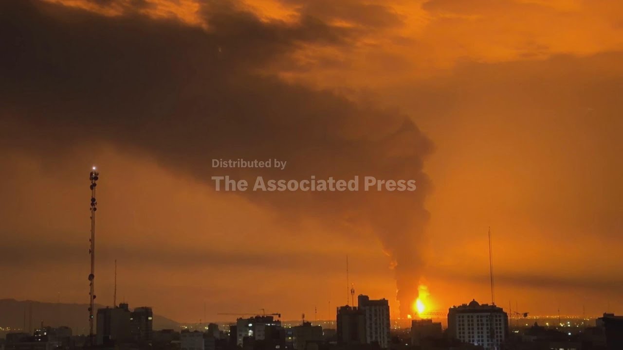 Fires send huge clouds of smoke into Tehran night sky after barrage of Israeli airstrikes