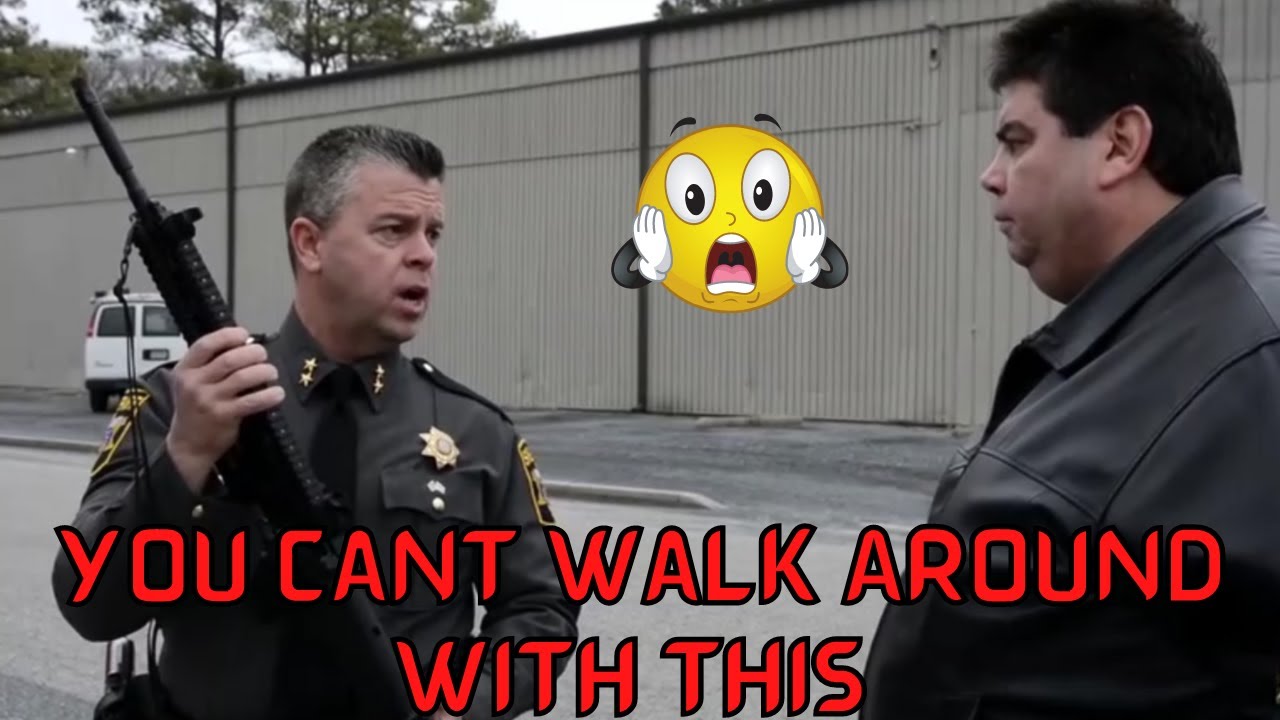 Frauditor Walking Around with A Rifle