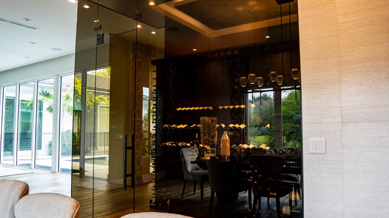 3 Modern Frameless Glass Wine Cellar Doors Designs