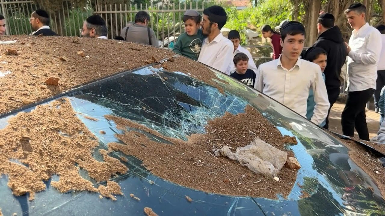 Ultra-Orthodox Jews in Bnei Brak inspect damage after Iranian missile attack | AFP