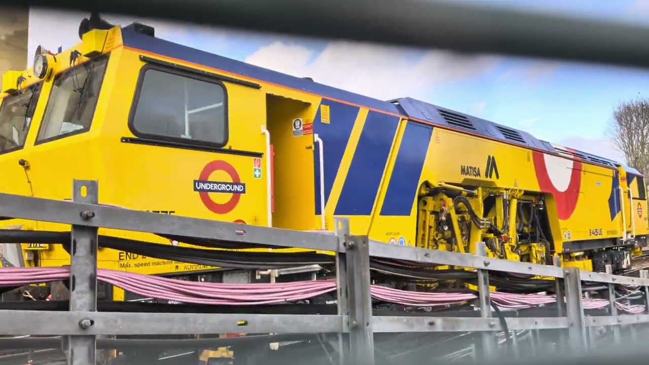 Network Rail train leaving Woodford station 