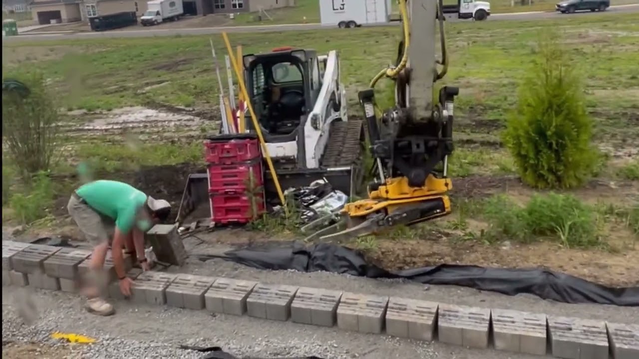 Engcon tilt rotator Building a Versa Lok retaining wall