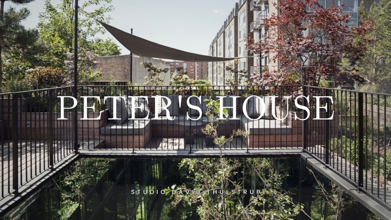 Designing Around the Central Atrium: A Bespoke Residence with Raw Concrete and Velvet Accents