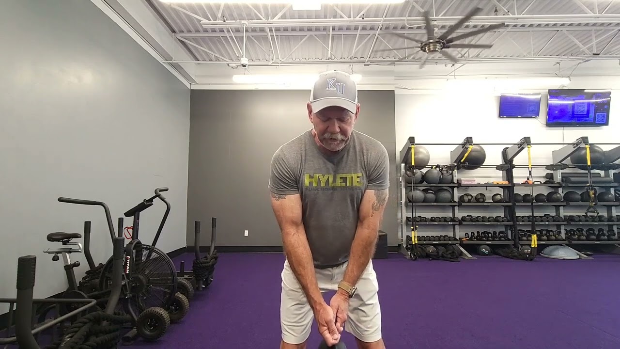 Kettle bell drill for more stable golf swing