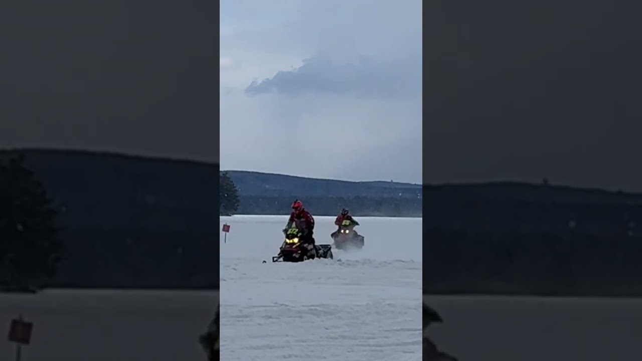Semi-Pro Stock Race: Watch the Thrilling Snowmobile Action! 