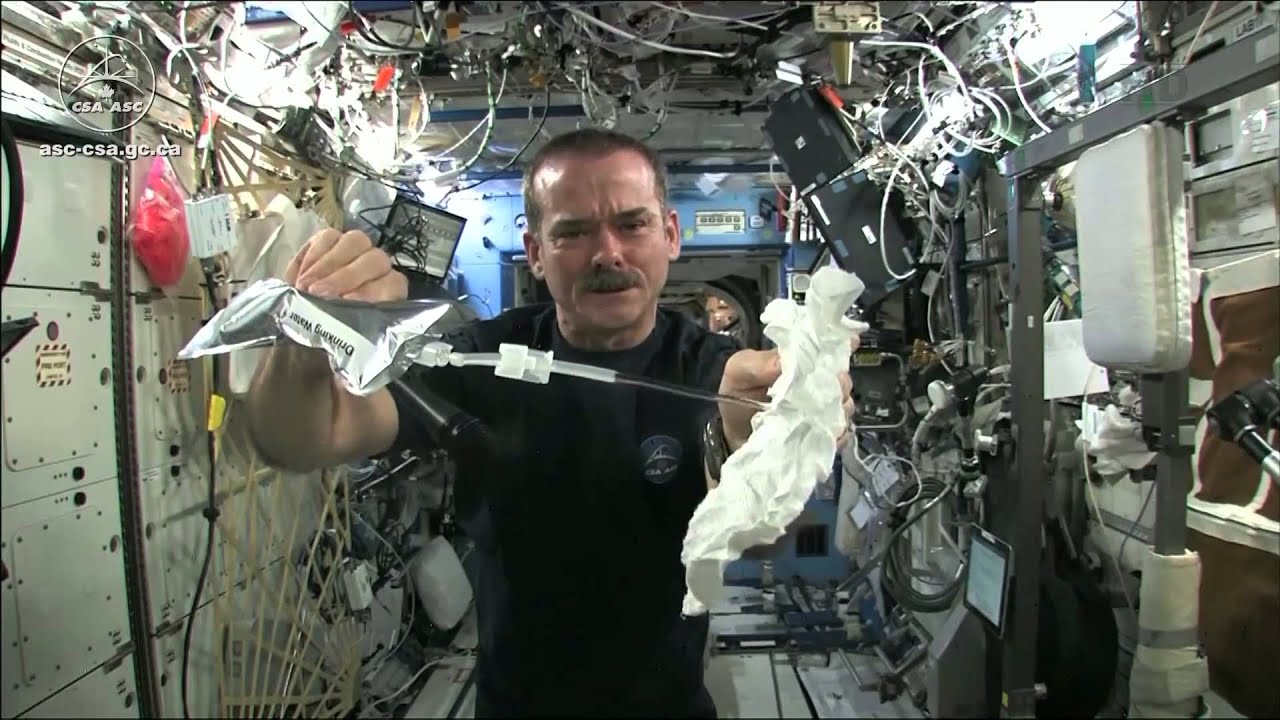 Wet Washcloth In Space - What Happens When You Wring It? | Video