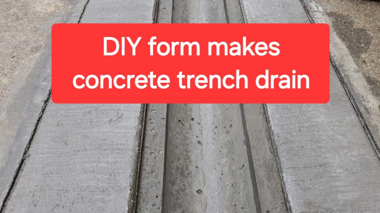 Channel drain in concrete from homemade form, covered with steel bar grating