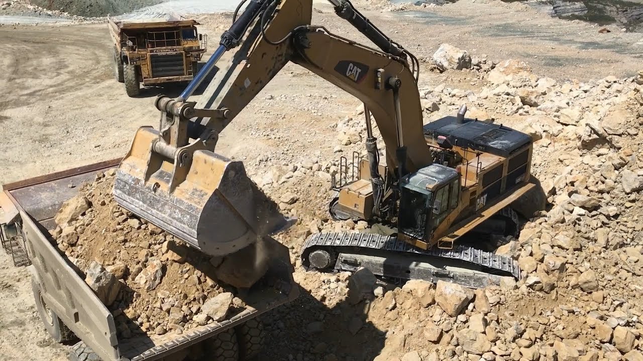 Caterpillar 385C Excavator Loading Caterpillar And Komatsu Dumpers - Kivos Ate