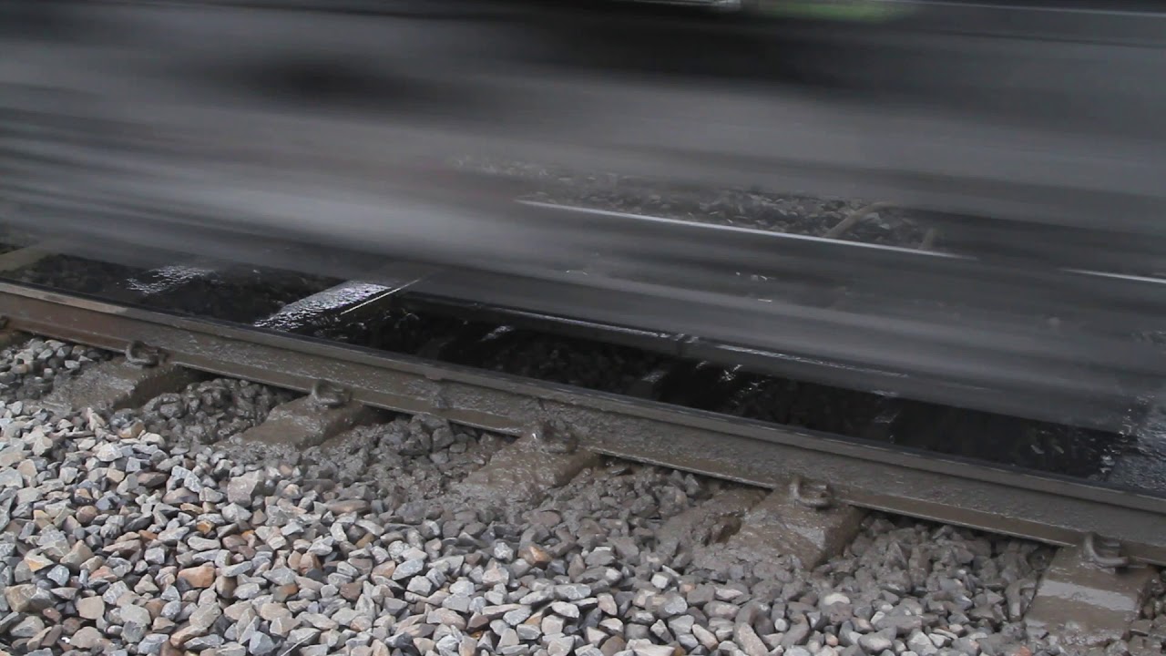 VLocity train passes over a mud hole