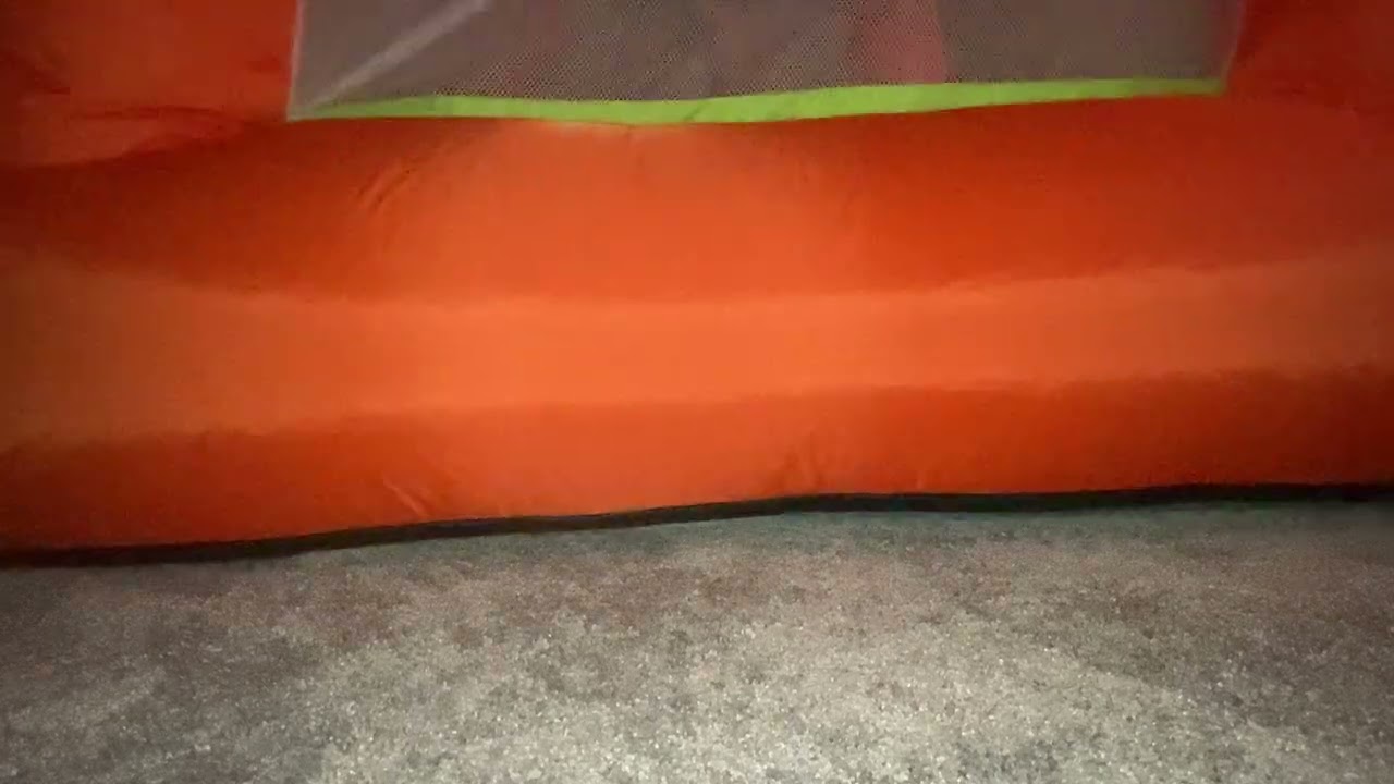 Jumping hard on the bounce house