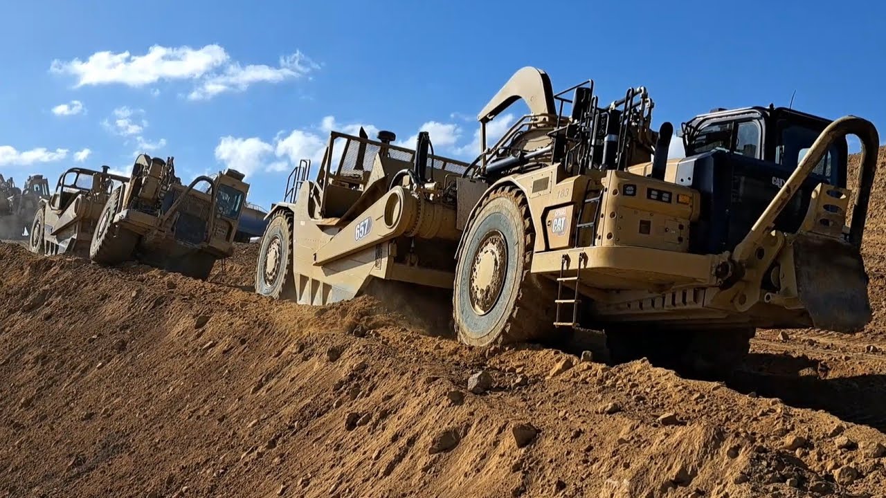 CAT 657 Scrapers moving a mountain