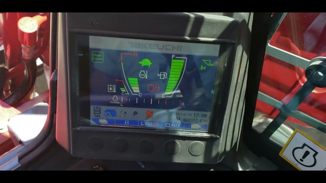 Setting up the auxiliary hydraulics on a Takeuchi TL12V2.
