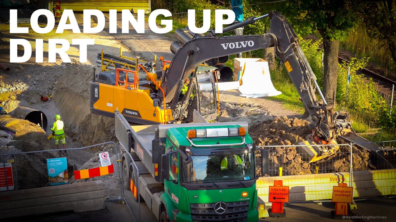 Volvo EC220EL Excavator Loading Mercedes Truck With Dirt
