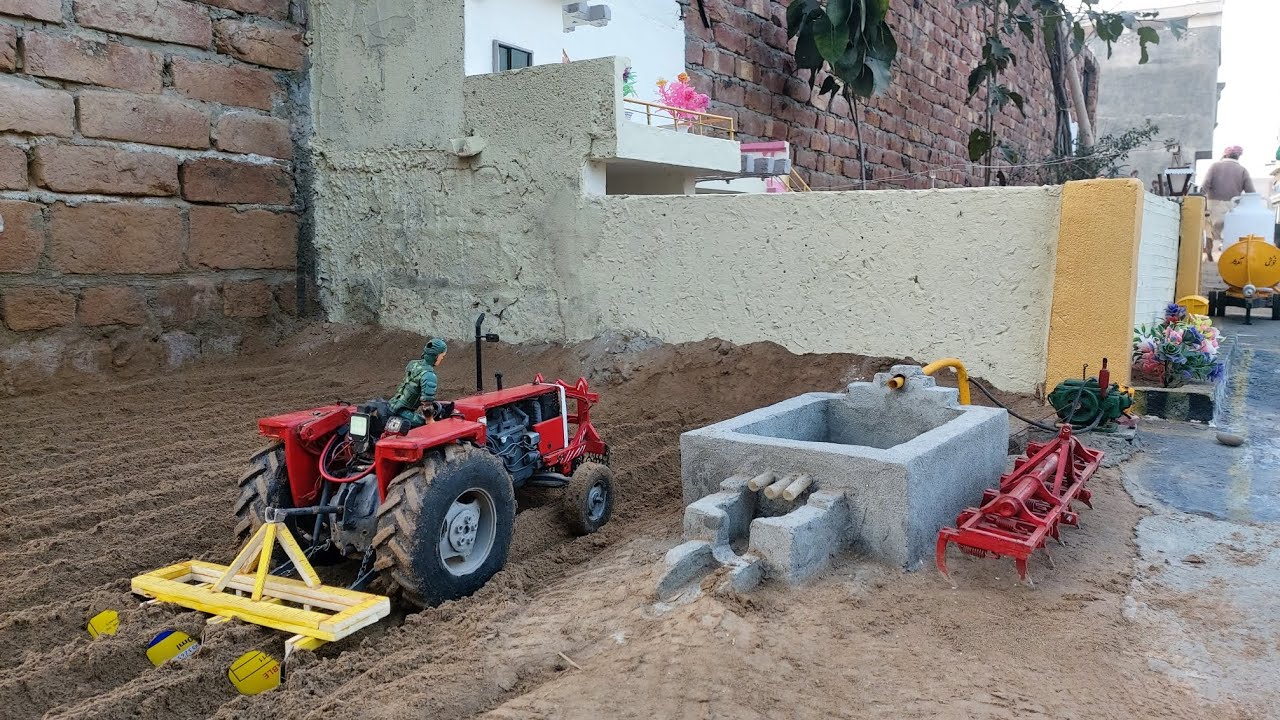 mini mf 385 tractor working in field 