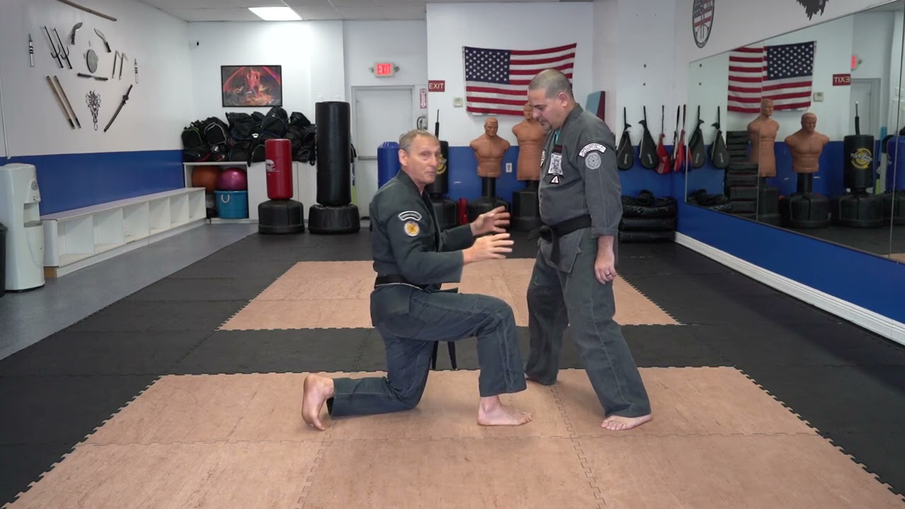 Executing the American Kenpo technique Bowing to Buddha