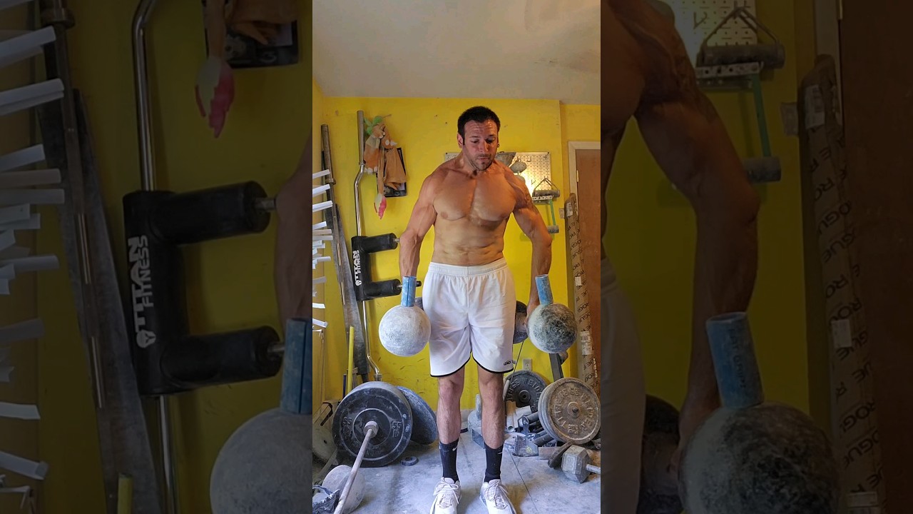 Lifting Two Thomas Inch Dumbbells
