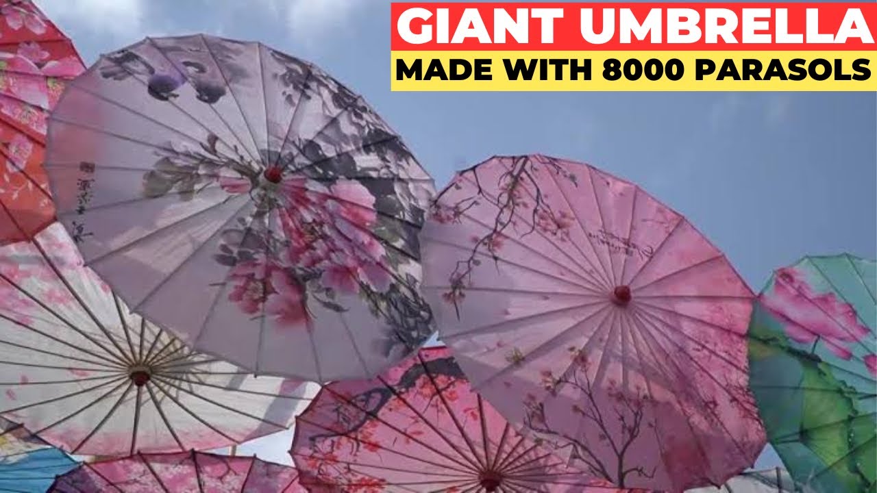 Shade in China! Artists combine 8,000 parasols to create giant 'Umbrella in the Sky'
