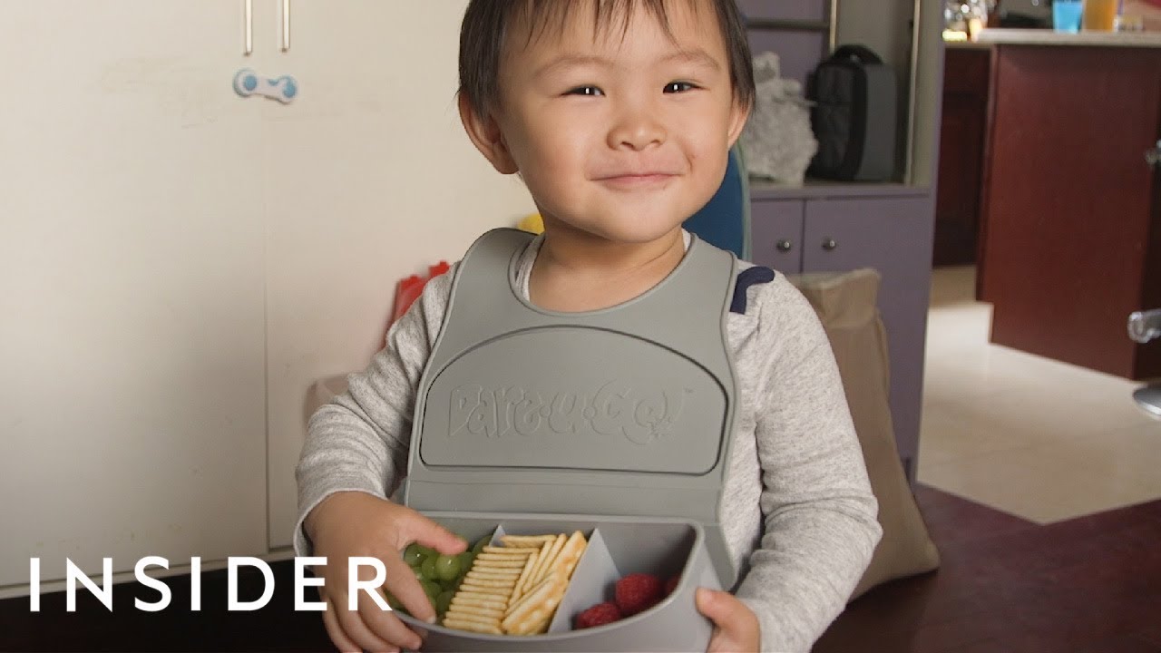 Travel Bib Has Three Compartments To Hold Kids' Snacks