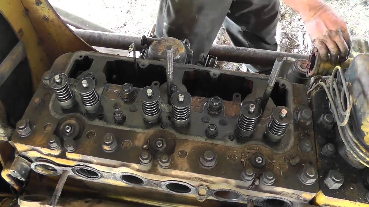 Removing Cylinder Head Off CAT D8 Dozer