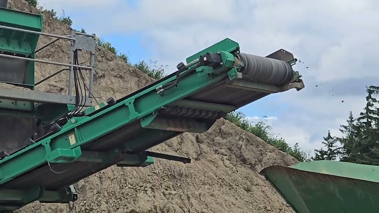 Getting A Load Of Topsoil Under Conveyor Belt.