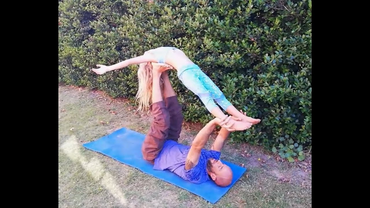 Father and daughter Acro-Yoga