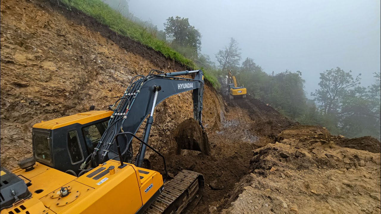 Risky Mountain Village Roadwork: Hyundai Excavator Clearing Rocks and Dirt | Hilly Road Construction