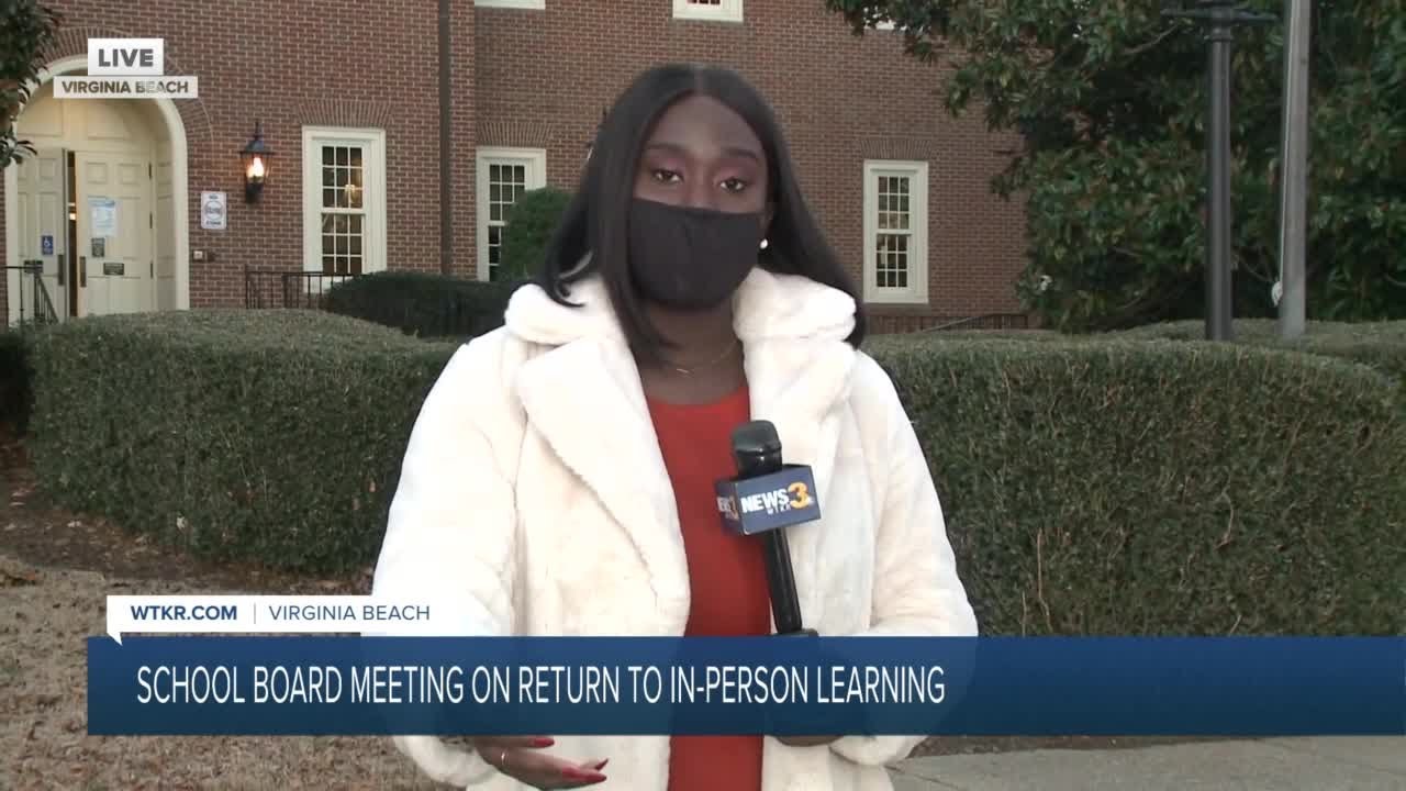 Group rallies outside school building/leaders set up