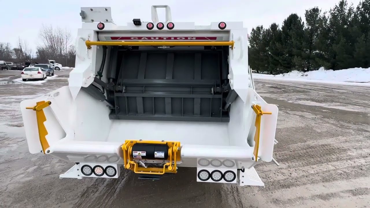 Isuzu NRR with Rear Load Garbage Body