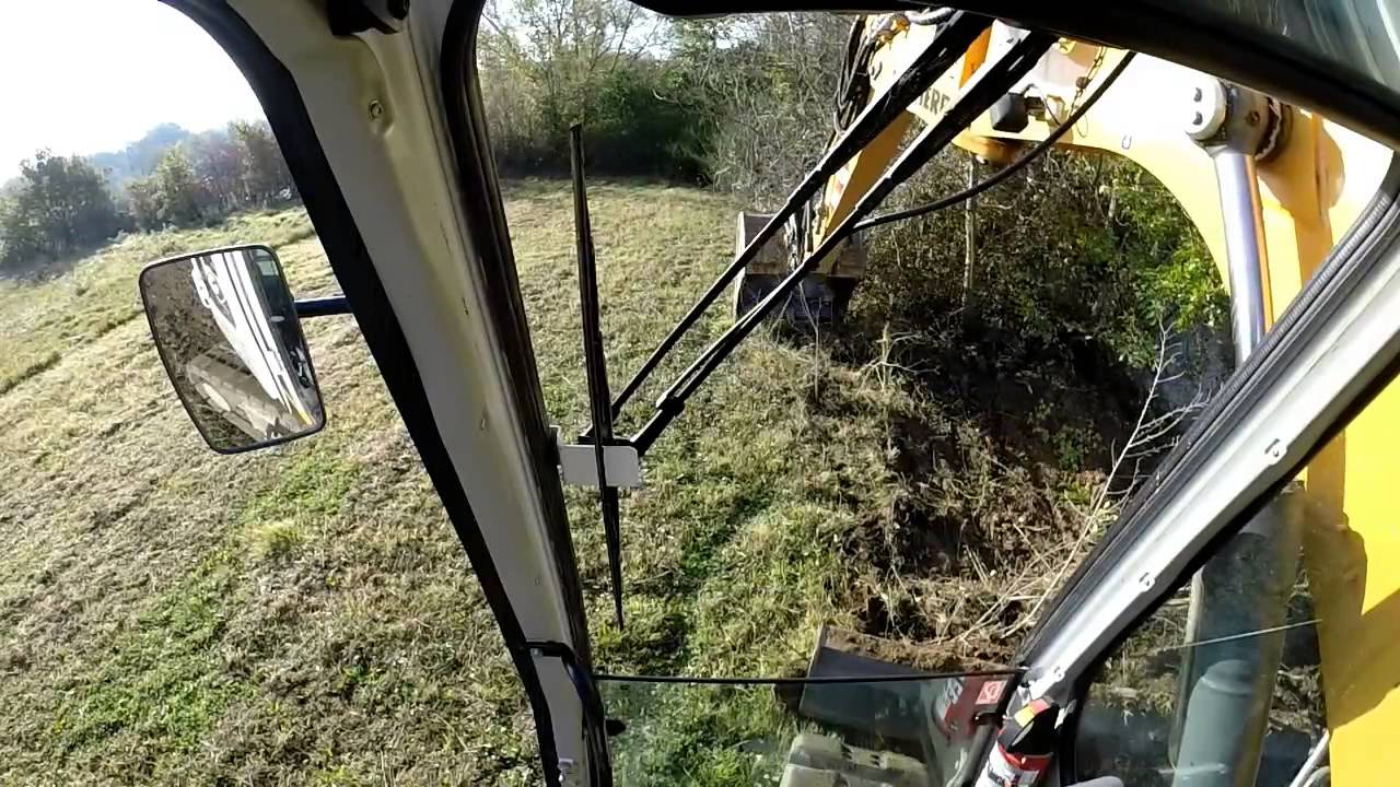 Liebherr r 313, nettoyage de berge