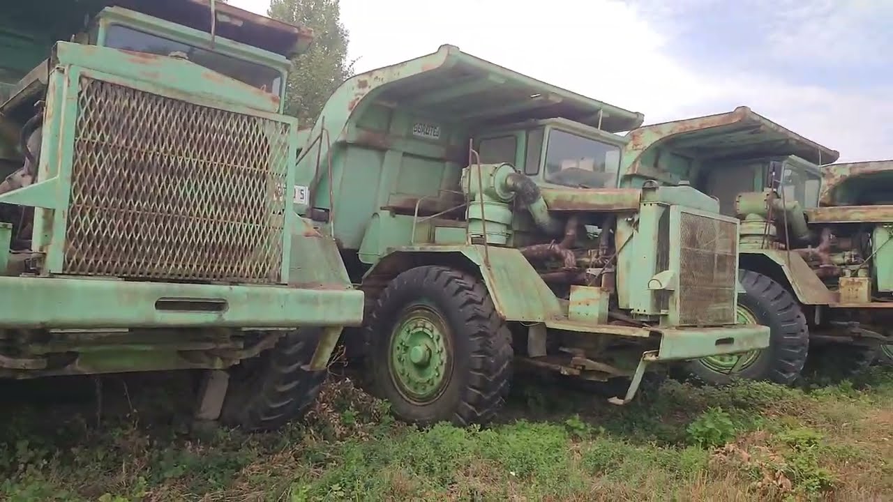 The Largest Single Fleet of Intact Old Cat & Euclid Rock Trucks From the 70s Parked by the Roadside