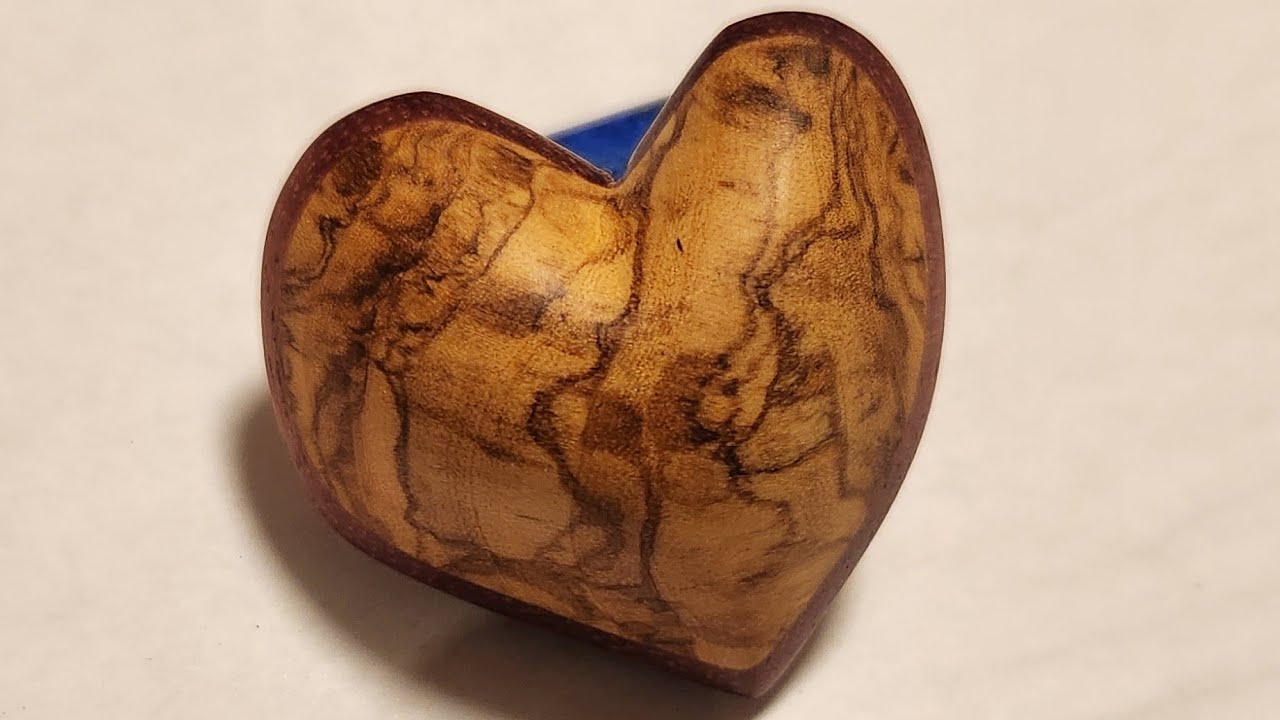 Wood Carving a gorgeous heart out of Olive wood and Purple Heart wood