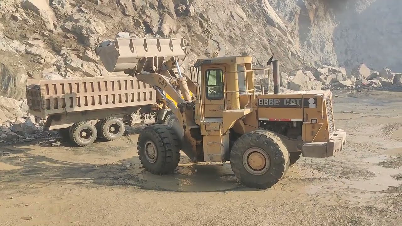 Dumper & Trolley loading Stone in mountain view: with Caterpillar Loadar amazing work