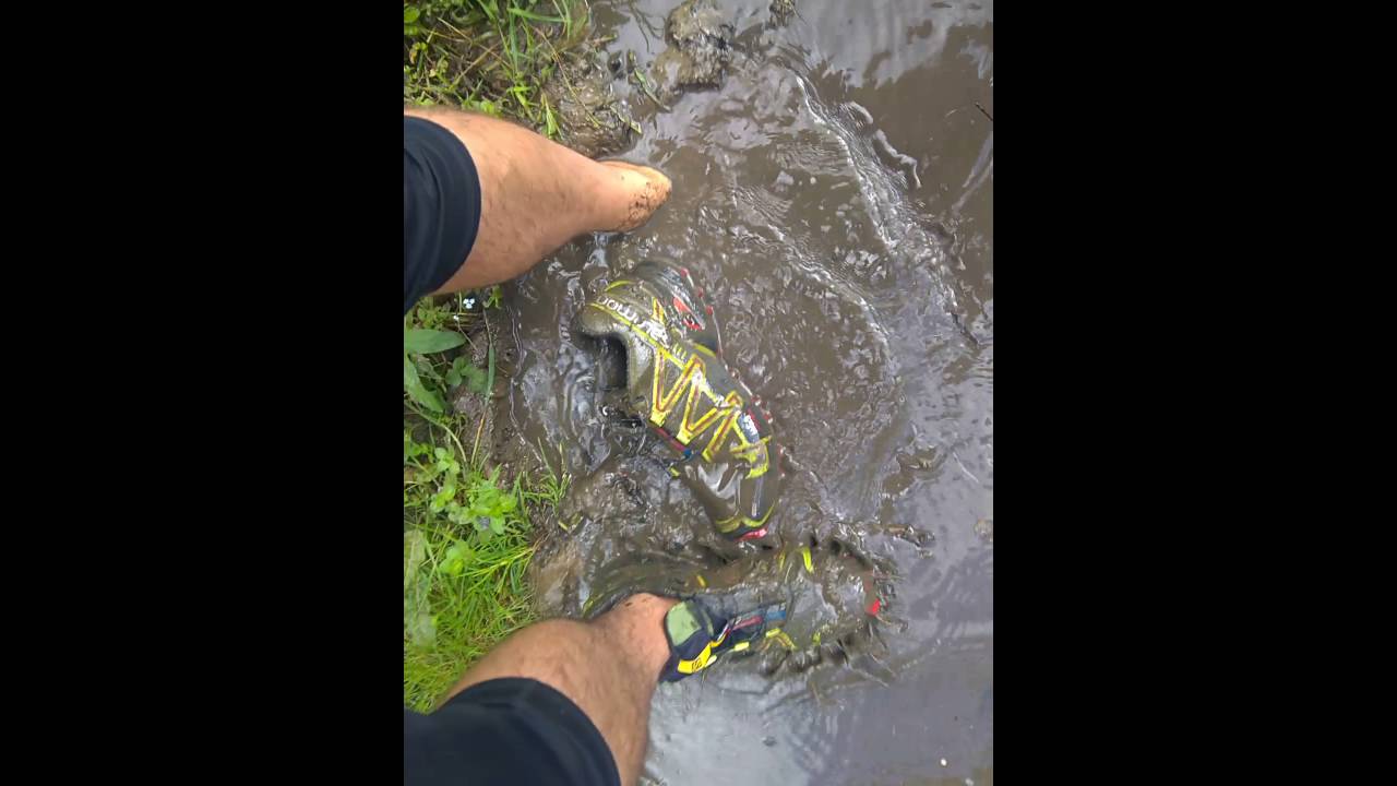 Salomon Speedcross 3 are getting wet and muddy.