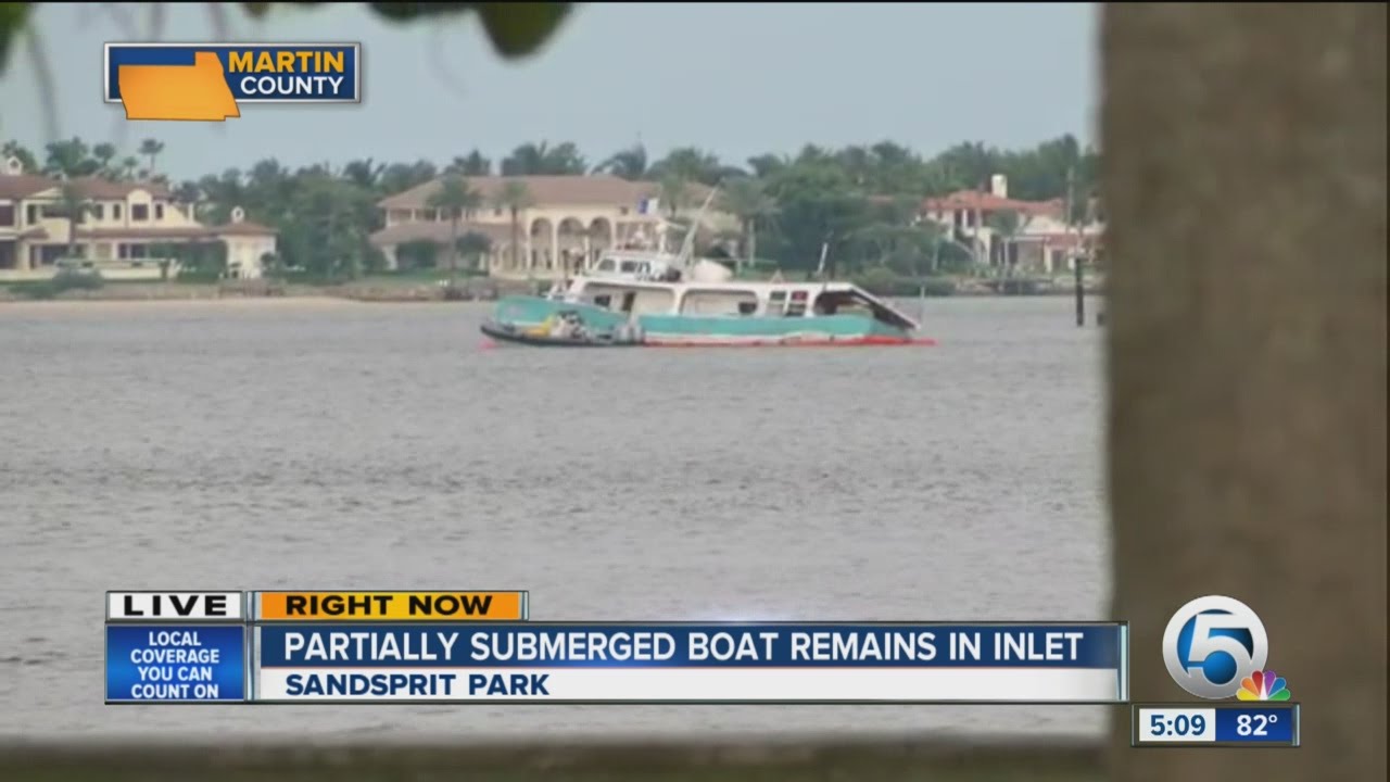 Partially submerged boast remains in inlet