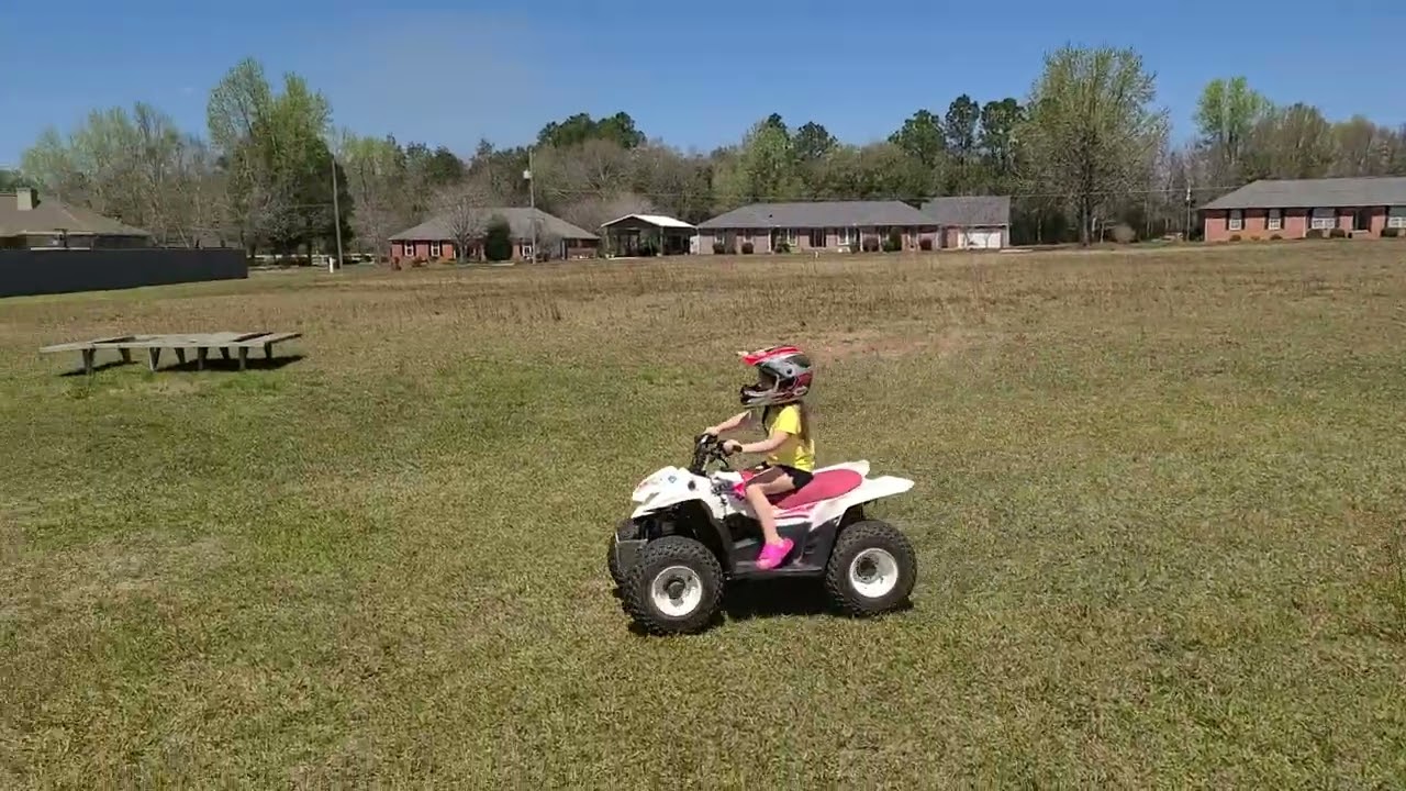 Granddaughter riding the Suzuki LTZ 50 for the first time.