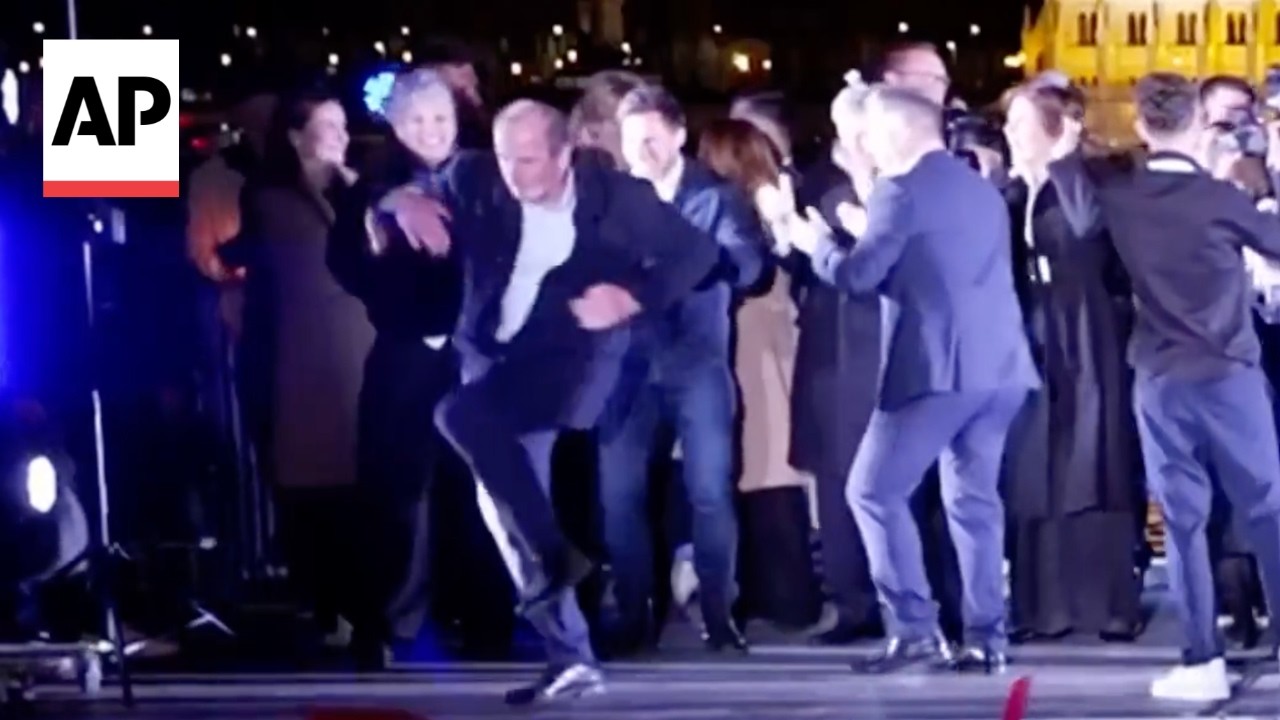 Hungary politician dances on stage after P&eacute;ter Magyar wins election