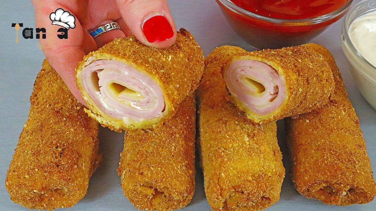 Это может вызвать привыкание! Он такой хрустящий и вкусный! Рулетики в панировке с сыром и ветчиной!