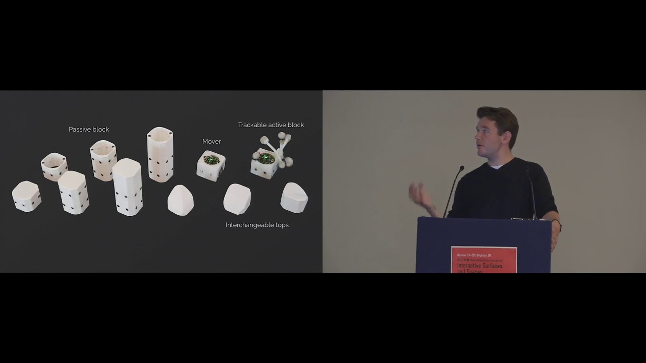 Robotic Assembly of Haptic Proxy Objects for Tangible Interaction and Virtual Reality