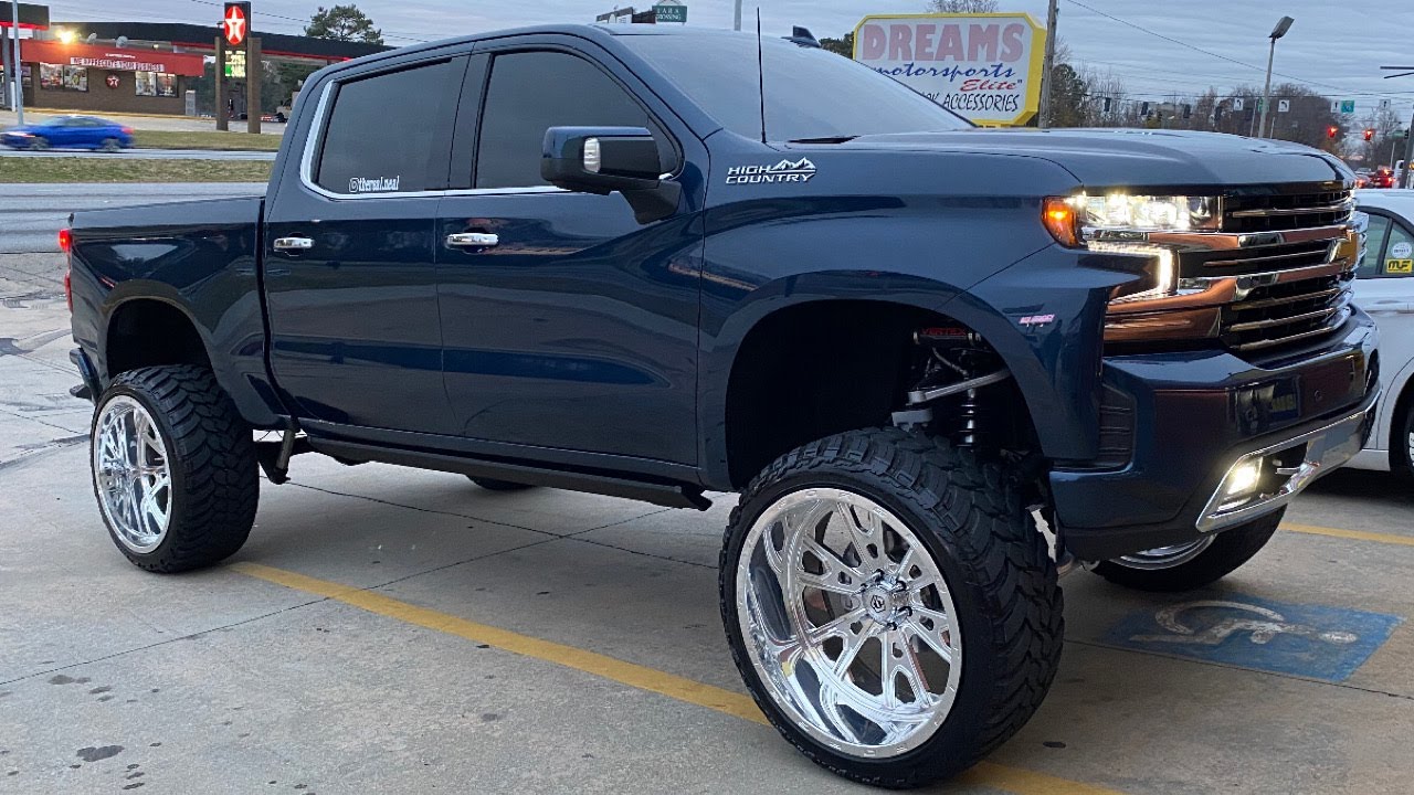 Lifted Silverado on a 9 Inch Rough Country Lift Kit | 26x14 TIS Forged on 37s