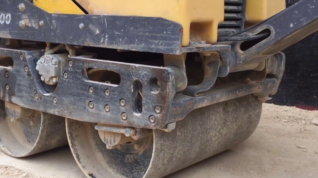 Hand roller compaction soil in foundation by Umair world